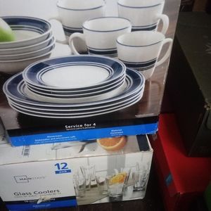 A set of dishes and a aet of glasses